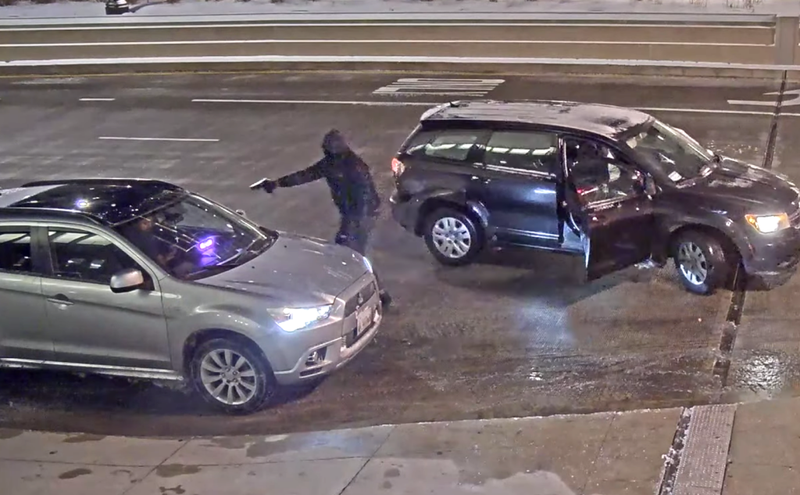 Screenshot of surveillance video showing a carjacking in the 200 Block of South Wacker Place near Willis Tower.