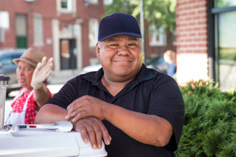 Felipe Vallarta, 58, an elotero, serves corn from his stand at the intersection of Clark and Rogers in Rogers Park, Sunday afternoon, June 24, 2018.