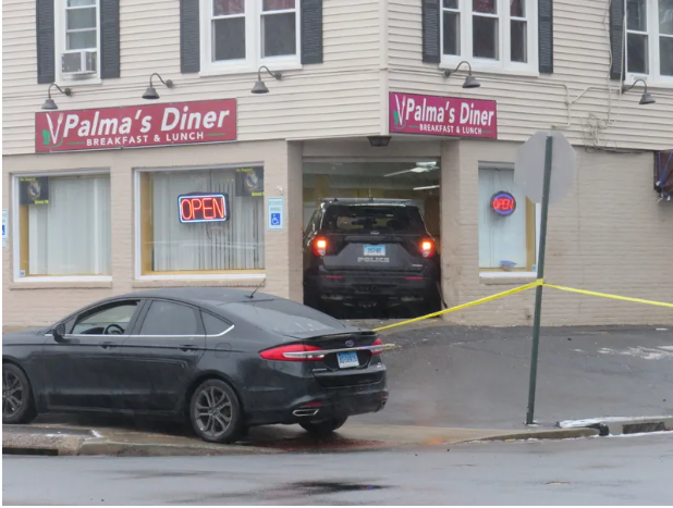 A stolen police SUV is lodged in the front entrance of Palma's Diner in Bristol, 1/12/23. 