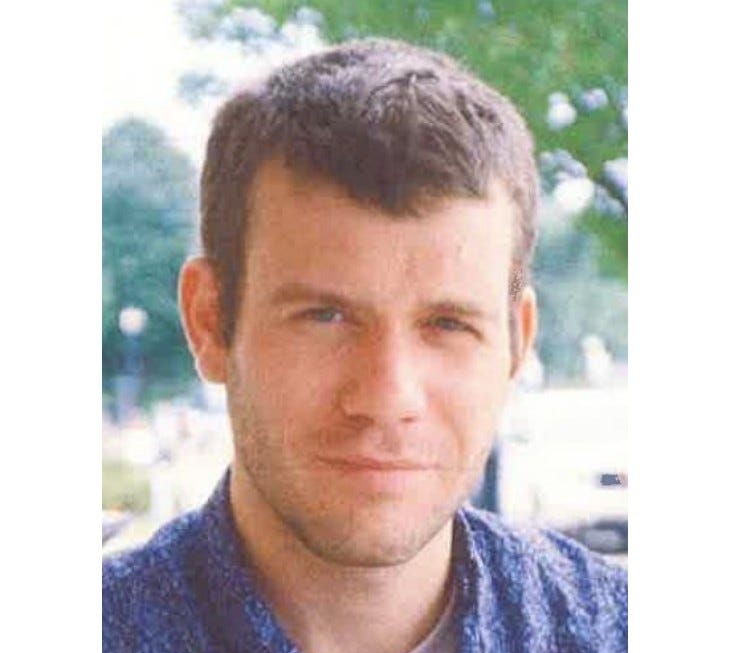 White man in 20s with short brown hair