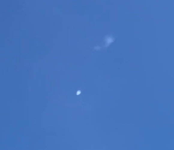 A screenshot of a video that may show the downing of a suspected Chinese surveillance balloon on the South Carolina coast Saturday, Feb. 4, 2023.