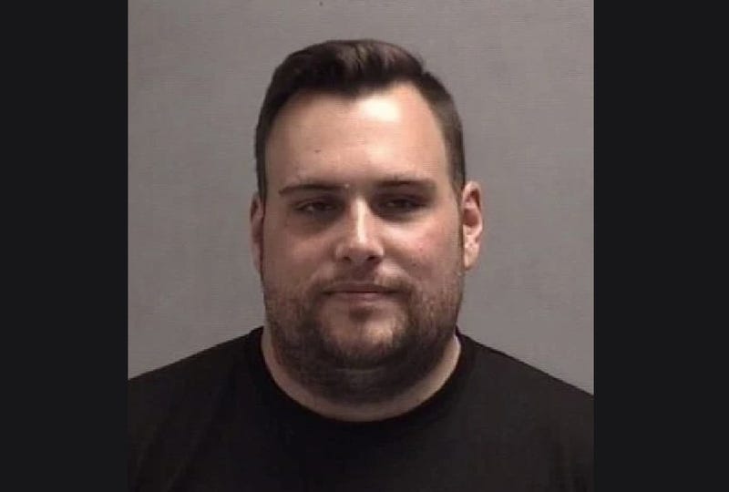 White man in 30s with short brown hair and beard