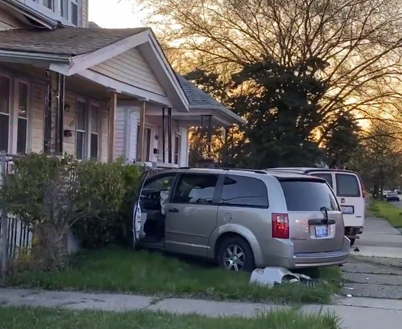A minivan crashed into the front porch of a house