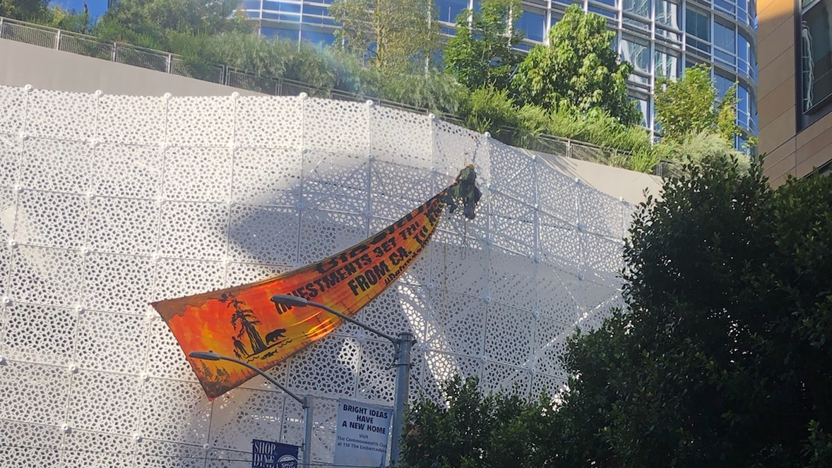 PHOTOS: 'Climate Chaos' protesters scale SF's Salesforce Transit Center, paint streets