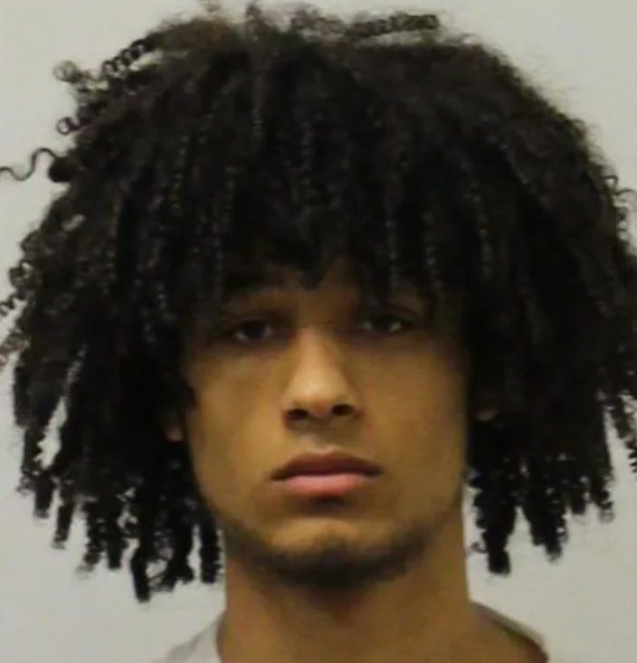 Young Black man with curly hair