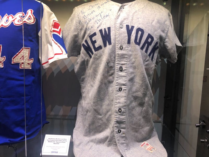 Auctions underway for autographed items from athletes like Mantle, Jordan, and Robinson