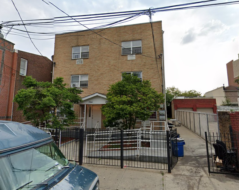 The apartment building where three people were shot Saturday night.