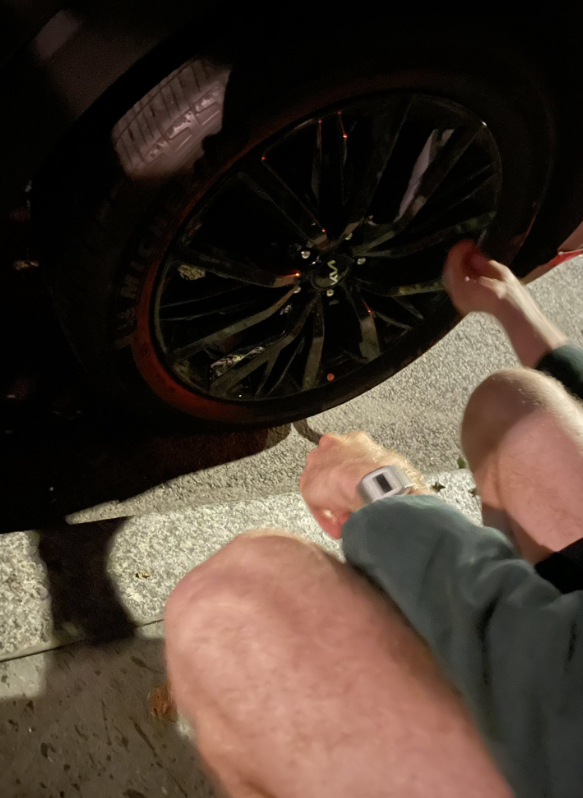 The group posted a picture from Wednesdays raid of two activists kneeling over a tire.