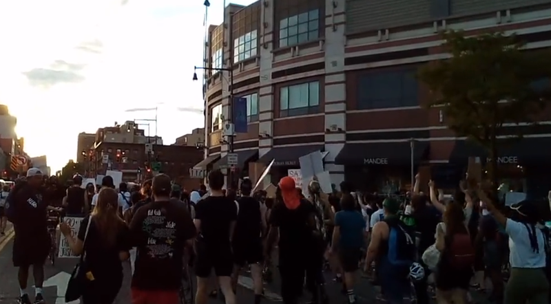 Protesters marching out of the plaza in front of the Barclays Center on Wednesday in response to the police shooting of Jayland Walker.