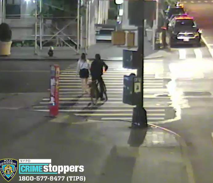 Security footage of the attacker riding up behind one of his victims.