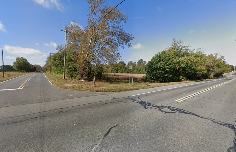 The intersection where a van crashed into a sedan, killing one and injuring 16.