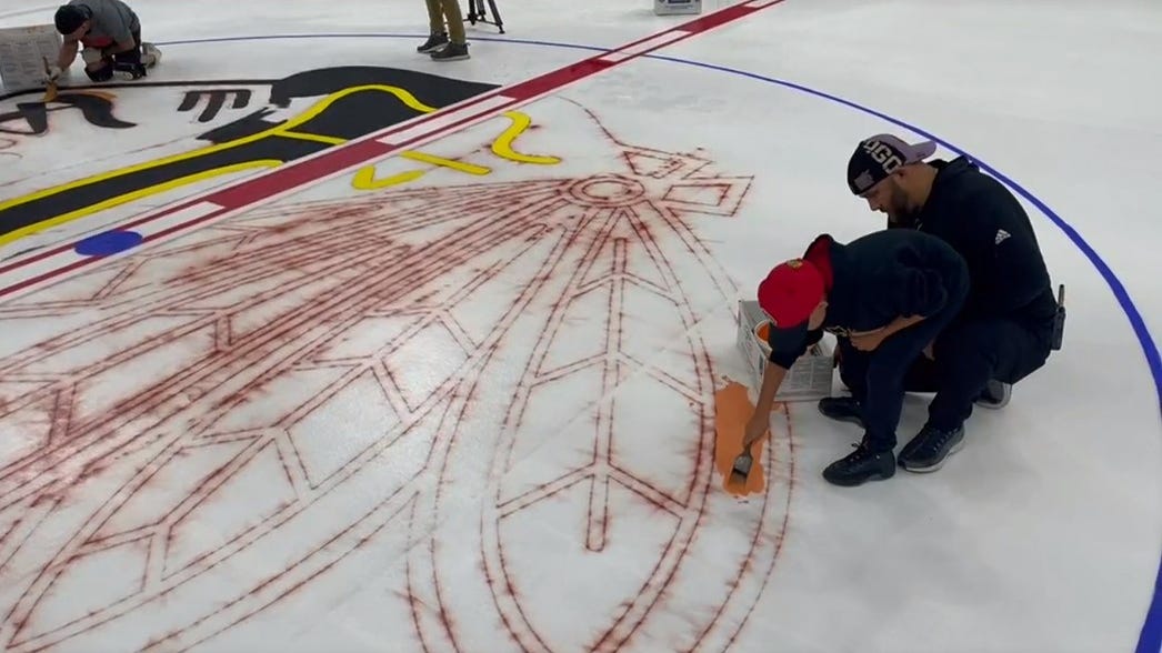 ‘I painted that!’ Chicago Blackhawks fans paint the ice at the United Center