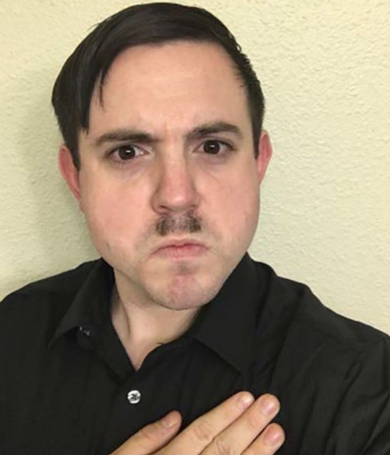 Timothy Louis Hale-Cusanelli pretending to be Hitler.