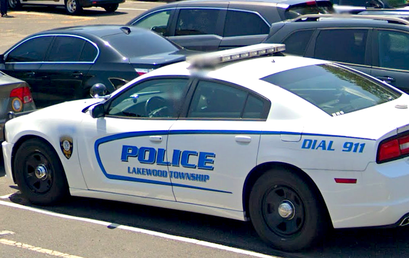 A Lakewood Township police car parked in the police department, municipal building's parking lot.