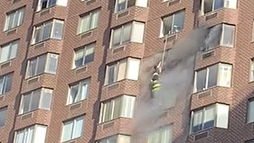 VIDEO: 38 injured in Manhattan blaze, firefighters rescue woman dangling from 15th-story window