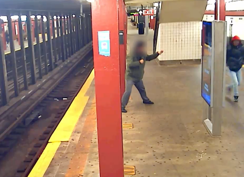 Video shows the victim putting up his fists in self-defense before he's surrounded by three attackers at the Parsons Boulevard station on Nov. 21
