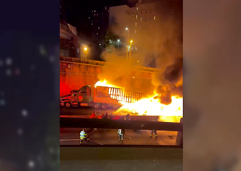 Video shows the semi-trucks and car consumed by fire after the crash