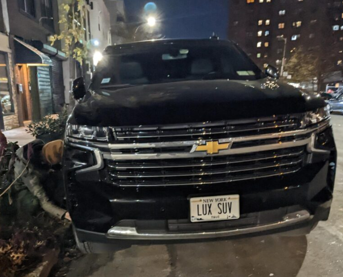 The Tyre Extinguishers posted a picture of an activist deflating an SUV tire with an SUV-themed license plate in New York City.