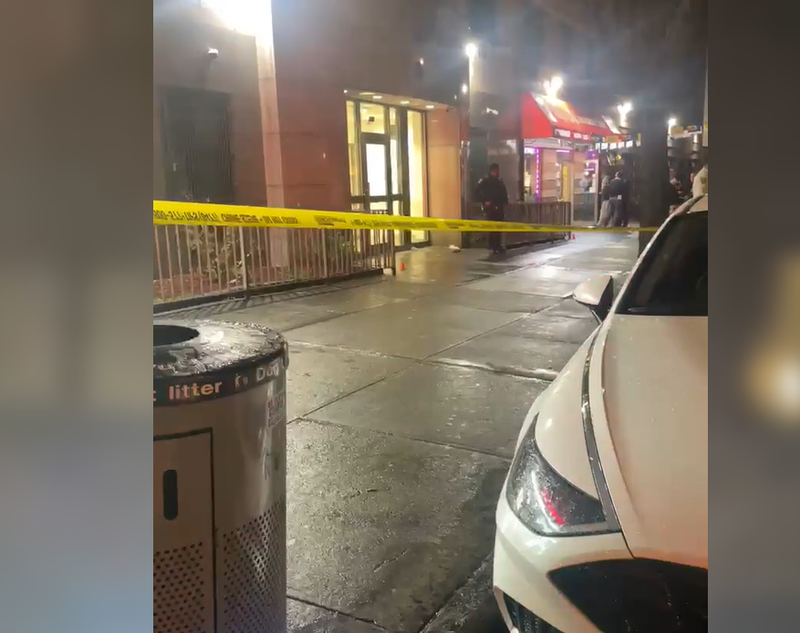 Police cordoned off the area outside the two Bronx delis where three people were shot on Tuesday.