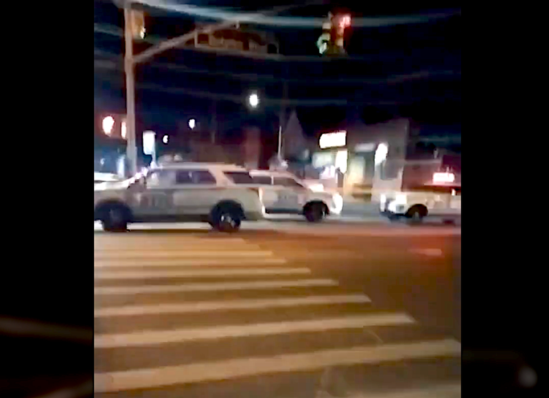 Police at the scene of a shooting in Jamaica on Dec. 27, 2022