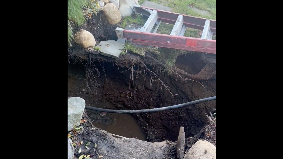 'Terrifying' sinkhole opens, swallows multiple people outside Suffolk home; 2 injured