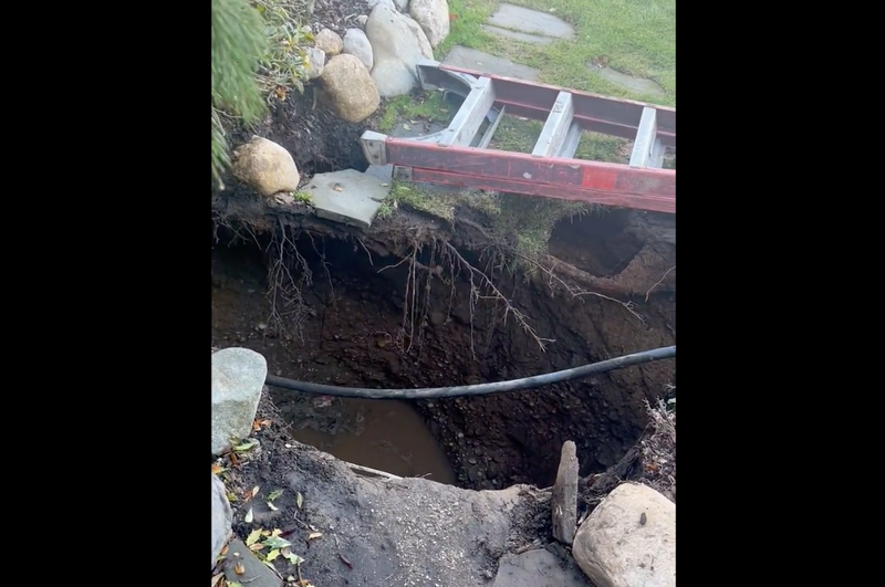 The sinkhole opened up in the front yard of a home on W. 10th Street in Huntington Station on Thursday morning