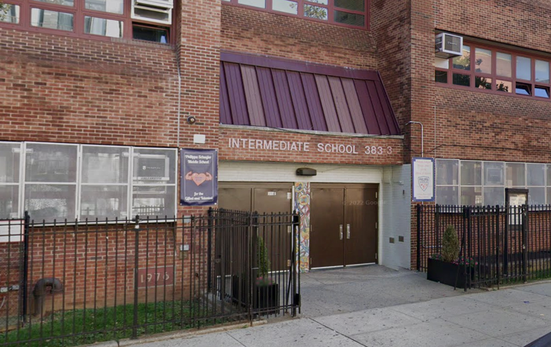 The dean of IS 383 was stabbed in the arm while breaking up a skirmish with a student on Monday afternoon.
