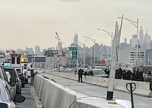 Emergency responders gather around the crash on the Bruckner Expressway.