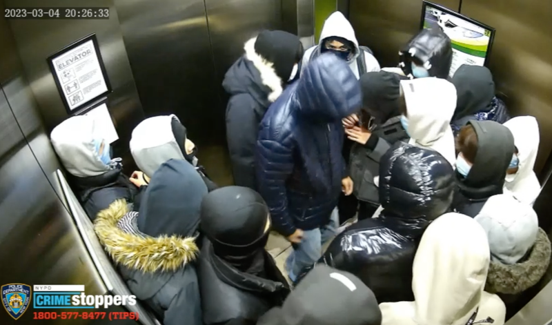 A surveillance camera captured the chaos crew in an elevator around the time of the onslaught