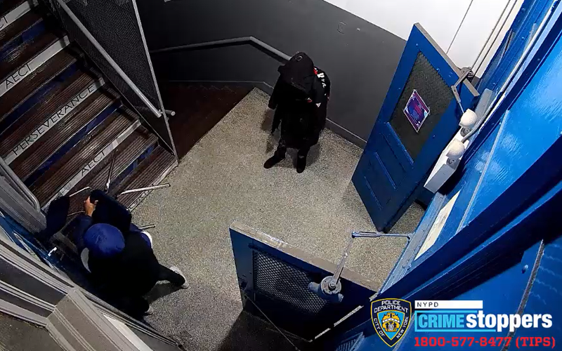 Security cameras captured footage of two of the burglars smashing a window with a chair.