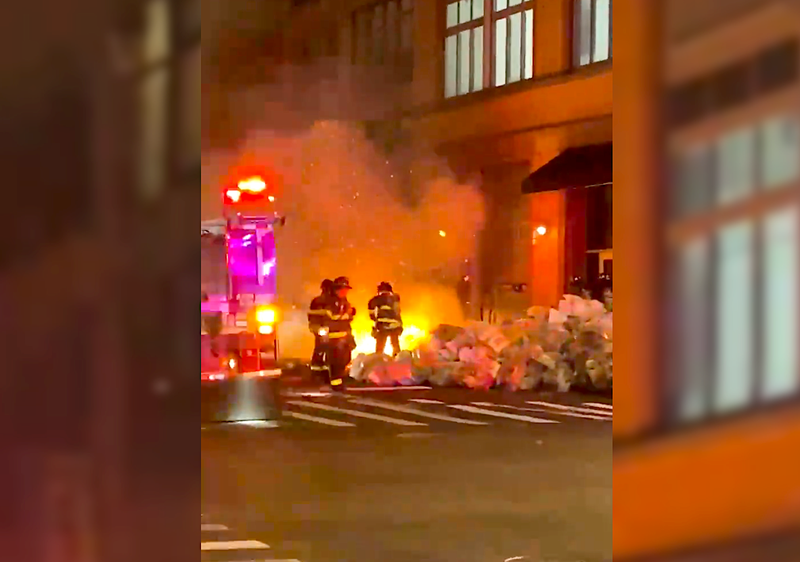 No injuries were reported in the fires, but the two cop cars were heavily damaged