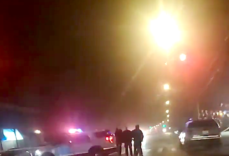 aPolice officers investigated into the night at the crash scene in Morris Park