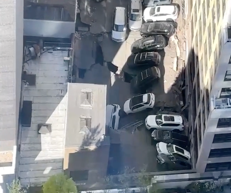 Video posted to Citizen showed cars falling into the hole left by the collapse.