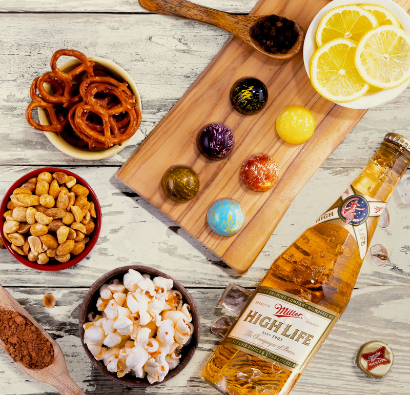 The pack of six gourmet chocolates is flavored with Miller beer and incorporates flavors of favorite bar food.