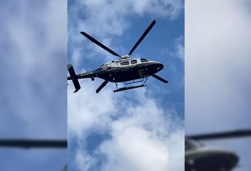 An NYPD helicopter over the crash scene on East 149th Street