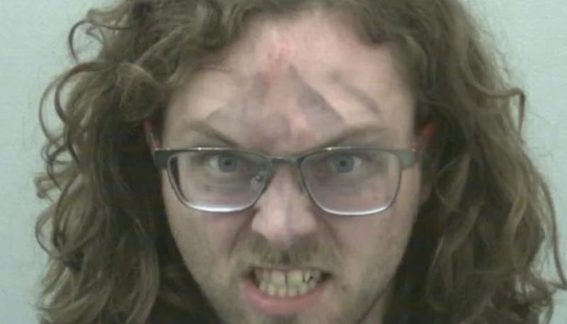 Scowling suspect charged with threatening Hartford police