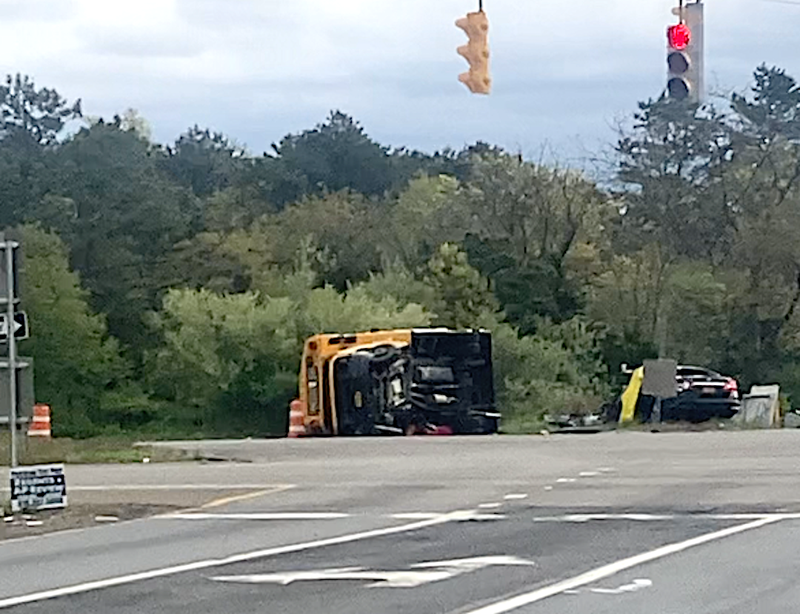 A mini school bus and a black sedan collided in Suffolk County on Thursday morning, killing a mother in her 30s and injuring her baby