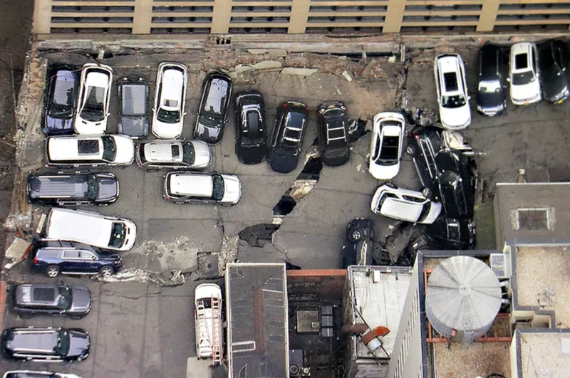 Cars are seen at the partial collapse of a parking garage in the Financial District of New York on April 19, 2023.
