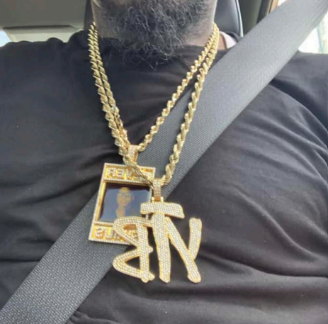 The stolen YTB (Yellow Tape Boyz) chain that led to the retaliatory shooting.