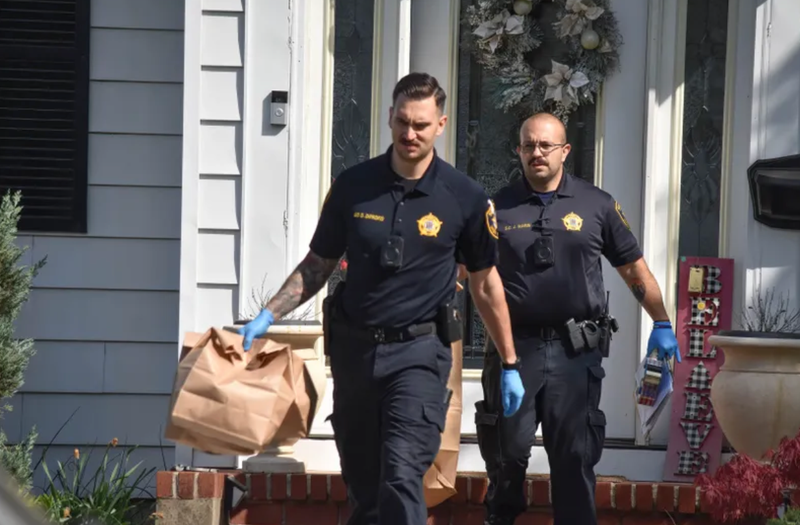 Investigators gather and collect evidence at the home in Roselle.