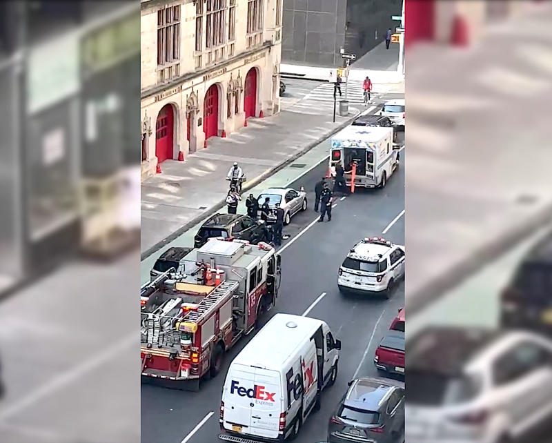 Emergency responders tended to the victim near Lafayette and White streets