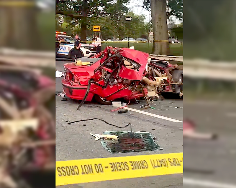 Video appears to show the red BMW traveling at a high rate of speed before crashing into a parked UPS truck on North Conduit Avenue