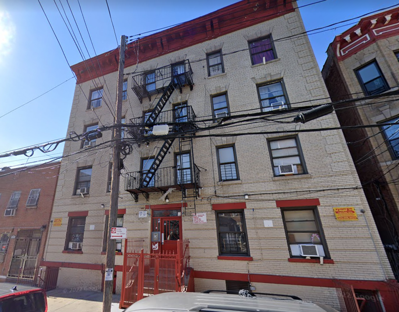 The apartment building where a man was discovered strangled to death on Friday.