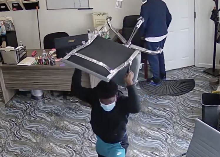 One of the men threw a chair during the caught-on-camera attack.