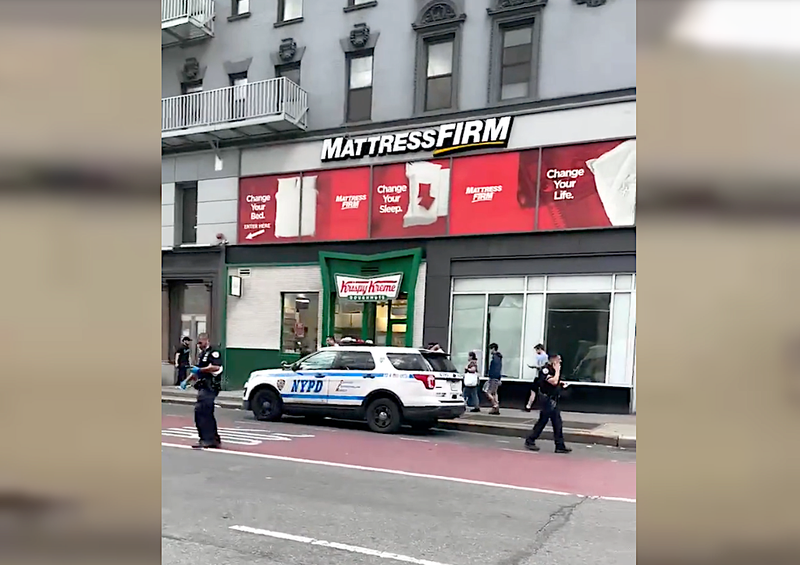 Police investigate outside the 86th Street station on the Upper East Side on Sunday afternoon