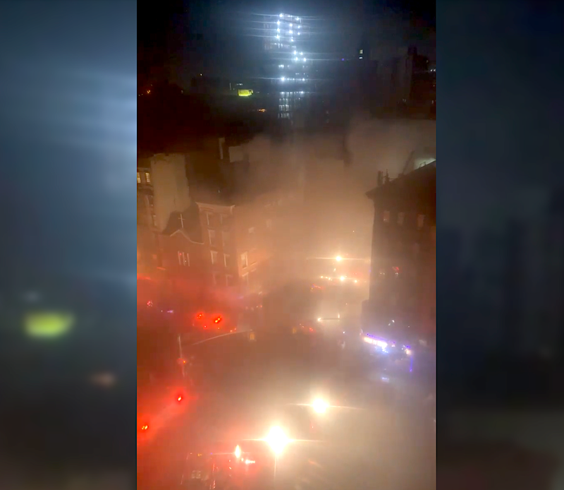 Smoke covered the intersection of Madison and Catherine streets early Tuesday as firefighters battled the fire