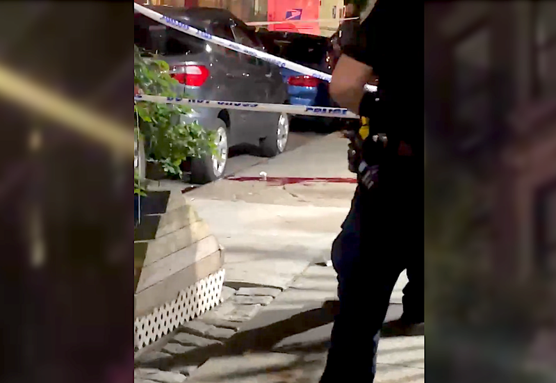 Blood is seen on the sidewalk of a fatal shooting at 230 West 140th St. in Harlem on June 19