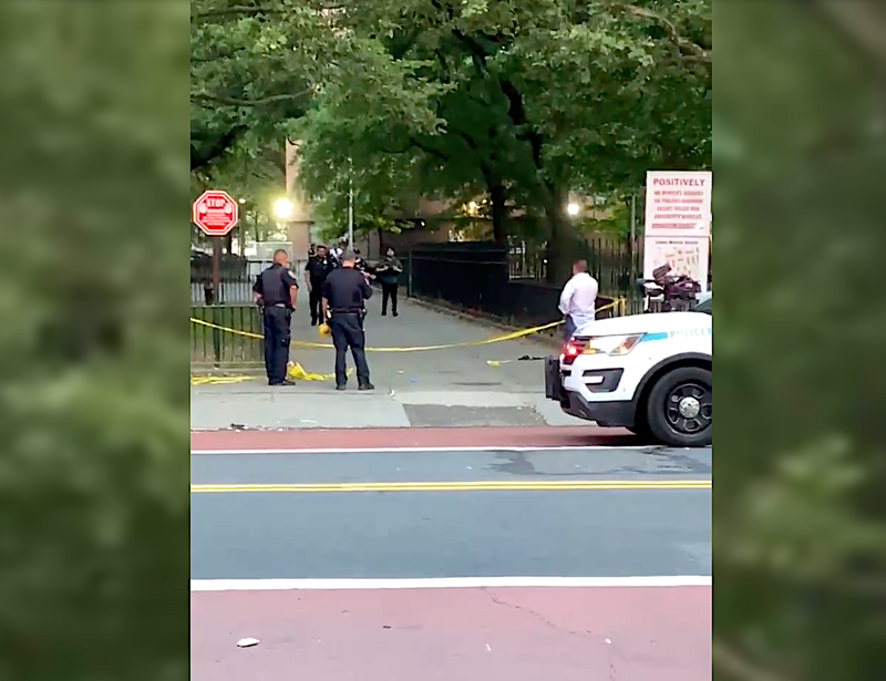 Police at the scene of a shooting that left a 24-year-old woman wounded in the Soundview section of the Bronx on June 19