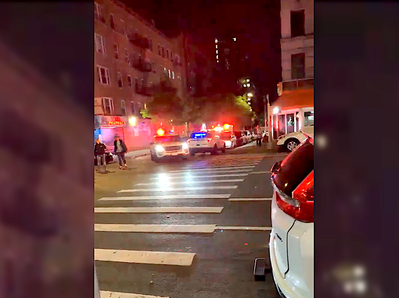 Two men were shot and wounded outside a fish market on St. Nicholas Avenue early Thursday
