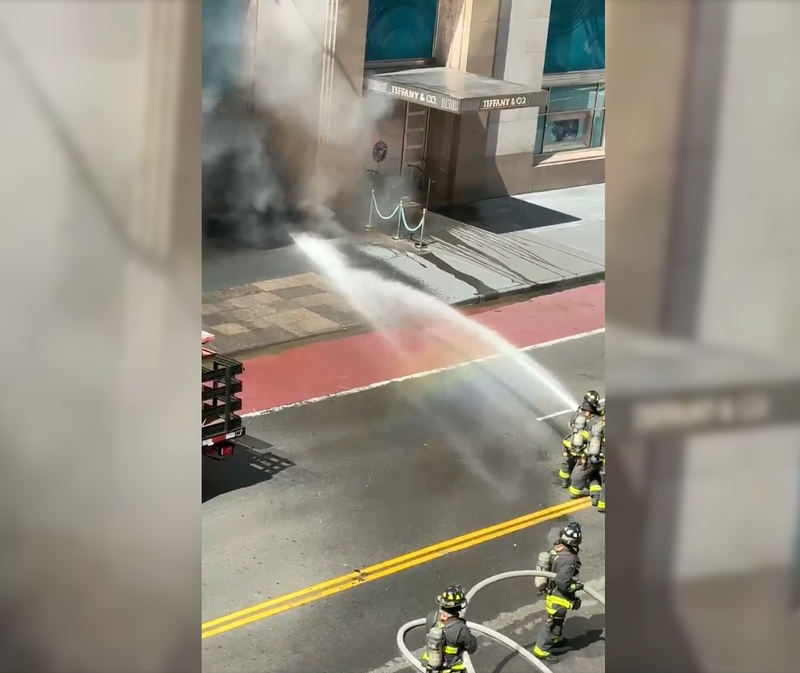 Firefighters battle a smoky fire at the Tiffany & Co. flagship in Midtown